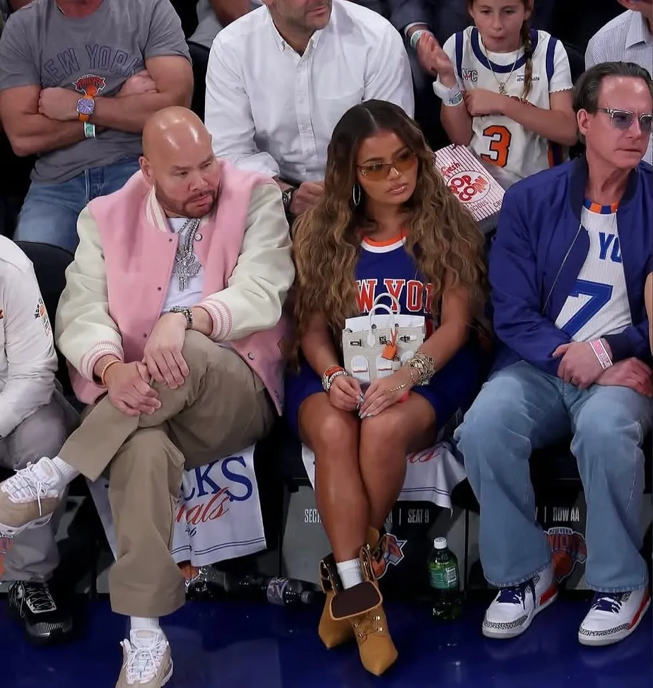 Azzy Milan and Dad Fat Joe Step Out in Louis Vuitton and a 0K Hermès Faubourg Birkin Bag at the New York Knicks NBA Finals
